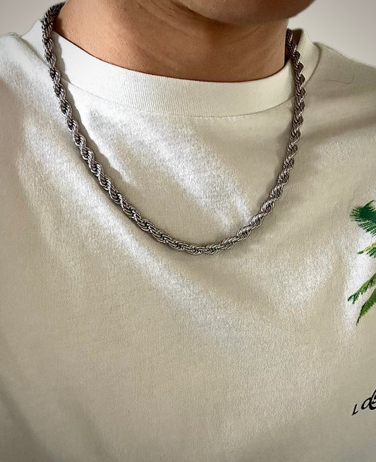 20 inch Solid heavy silver rope chain on a persons neck 